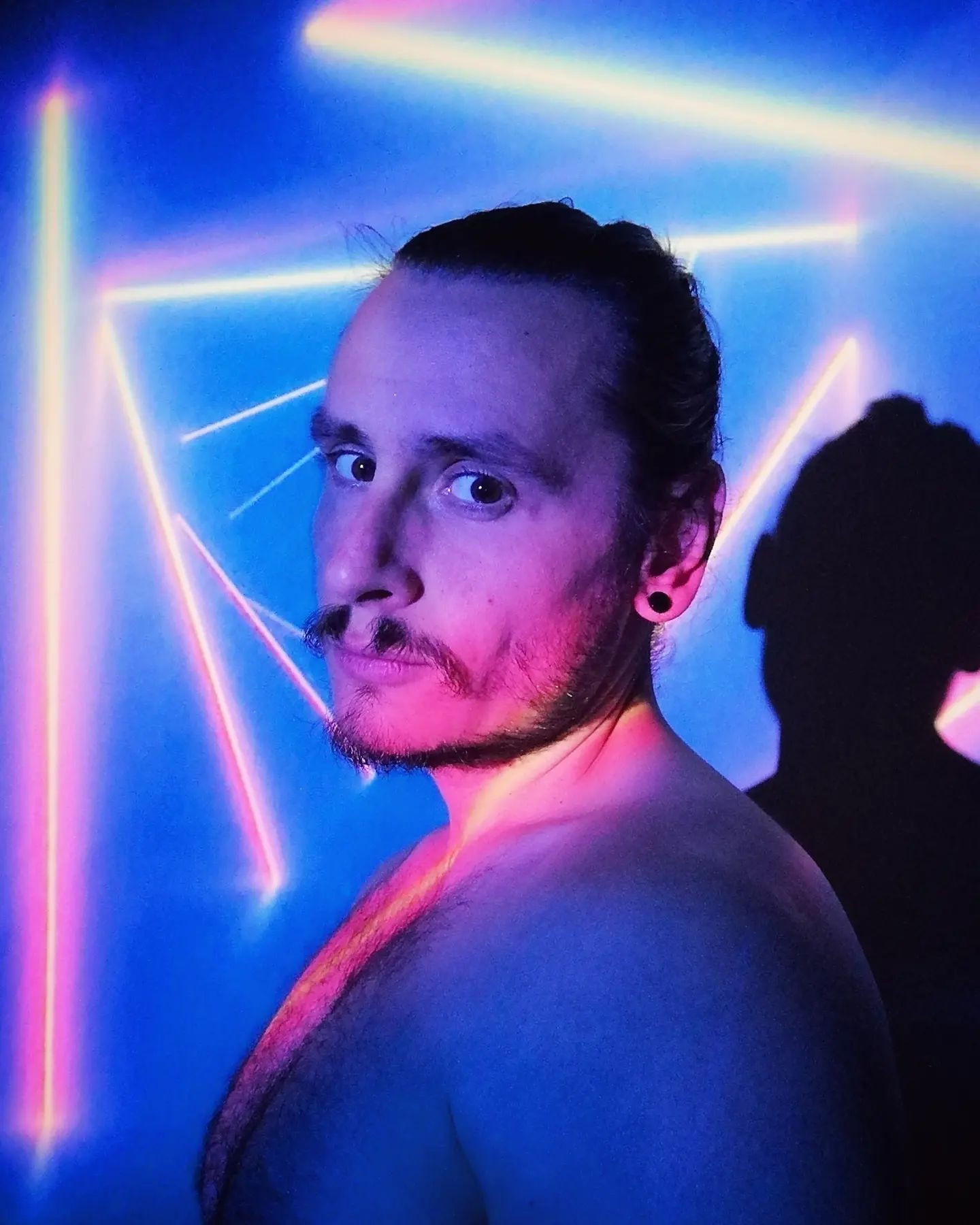 Something old I just saw and decided to share with you. I think that's 2019 because I had long hair then.
.
.
.
. #blue #neonlights #portrait #instaphoto #photooftheday #longhair #autoportrait #2019 #lights