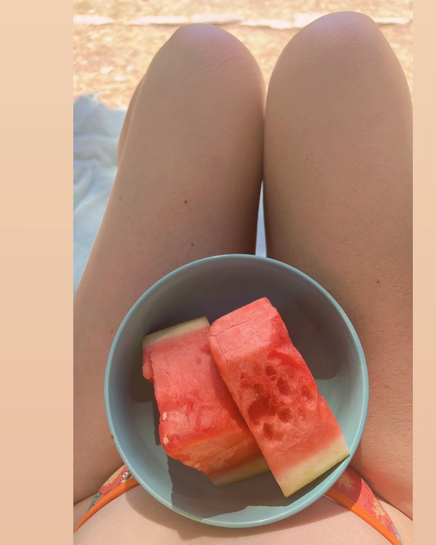 Eating watermelon and drinking fresh-squeezed orange juice in my California oranges bikini because I love a good theme 🍊🍉